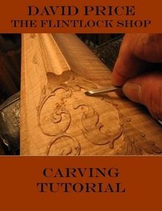 a person is working on a wooden object with the words carving in front of it