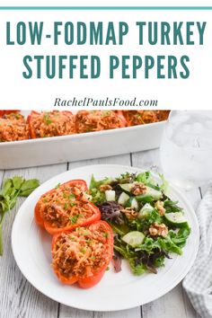 low - fodmap turkey stuffed peppers on a plate with salad in the background