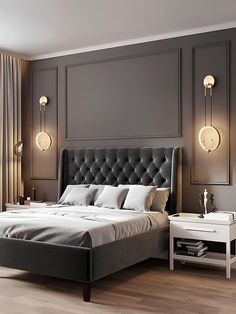 a bedroom with a bed, nightstands and two lamps on either side of the bed