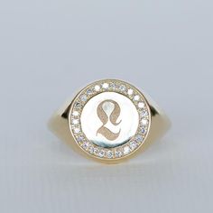 This is a custom 14K/18K gold and Diamonds Gothic Signet ring, the perfect pinky initial Signet ring.This pinky signet ring is classy and edgy, showcasing a personalized initial engraved in gothic script, surrounded by sparkling white Diamonds.Materials & Colors:*********************✤ 14K OR 18K yellow/rose/white gold. Please select your favorite color from the drop-down menu, when ordering.✤ 25 Natural conflict-free diamonds ✤ Diamonds Clarity: SI-VS, Color: E-G✤ Diamond Carat Weight: 0.1 C Luxury Signet Ring With Initials In Fine Jewelry Style, Classic Diamond Signet Ring With Initials, Luxury Initials Signet Ring Fine Jewelry, Luxury Diamond Signet Ring With Initials, Luxury Diamond-accented Signet Ring, Signet Ring Diamond, Custom Gold Rings, Gothic Script, Pinky Signet Ring