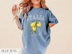 Trendy Italia "ciao bella' lemon graphic shirt for women. Great for an Italian girl's trip or travel souvenir shirt. Available in the colors Ivory, Pepper, Mustard, Black & Blue Jean. Relaxed unisex fit. True to size. Size up for an oversize look.  ~made with 100% ethically grown, ring-spun US cotton for long-lasting comfort. ~relaxed fit  ~pre-shrunk fabric ensures a consistently great fit All t-shirts are made to order and can only be refunded if damaged or incorrect. Please message me before Italia Shirt, Lemon Graphic, Lemon Shirt, Airplane Shirt, Souvenir Shirt, Italian Travel, Travel Tshirt, Italy Trip, Ciao Bella