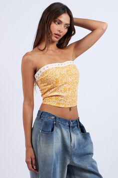 The Cora Orange Floral Print Tube Top is a summer essential! Orange floral print fabric shapes this strapless tube top with a cropped bodice. Features a ribbon trim detail and an exposed back zipper/closure. Style with a denim skirt for a cute summer look! DETAILS & FIT Fitted. S: 11" Length, 28" Bust M: 11.5" Length, 30' Bust L: 12" length, 32" Bust 100% Rayon. Lining: Polyester. For best results dry clean. Imported. ORDERS, SHIPPING & RETURNS: Orders, Shipping, & Returns Orange Floral Print, Boho Pink, Floral Print Fabric, Summer Essential, Pink Boho, Floral Print Tops, Ribbon Trim, Summer Look, Sierra Leone