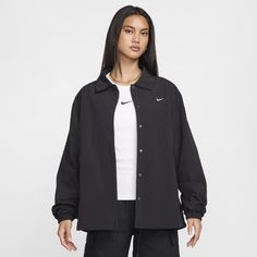 With both a water-repellent finish and built-in UV protection, this oversized jacket is ready come rain or shine. Its lightweight woven fabric is lined with sweat-wicking mesh to help keep you cool and dry. Black Long Sleeve Sports Raincoat, Oversized Functional Windbreaker For Streetwear, Moisture-wicking Techwear Windbreaker For Fall, Black Sports Raincoat For Fall, Fall Sports Black Raincoat, Fall Black Sports Raincoat, Black Sporty Raincoat For Fall, Sporty Black Fall Raincoat, Nike Nylon Windbreaker With Moisture-wicking