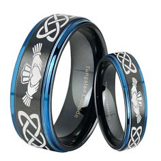 two black and blue rings with an intricate design on the inside, one is made out of