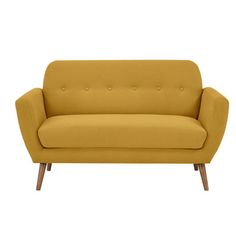 a yellow couch sitting on top of a white floor next to a wooden leg chair