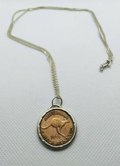 Vintage bronze Kangaroo coin from Australia 🇦🇺 Commonly used in the years : 1959-1964 Turned into a one of a kind, unique pendant. Handmade and comes with a sterling silver necklace - you choose the length 😊 If you want to buy the pendant without a necklace, please contact me. 55 cm = 21 inch 60 cm = 24 inch 65 cm = 26 inch Coin is showing a kangaroo leaping right Lettering : AUSTRALIA 1959 HALF PENNY Reverse : 1st portrait of Queen Elizabeth II wearing a laurel Coin Features : Country : Aust Minimal Pendant, Coin Earrings, Coin Ring, Coin Jewelry, Unique Pendant, Cool Necklaces, Travel Jewelry, Coin Pendant, Silver Coins