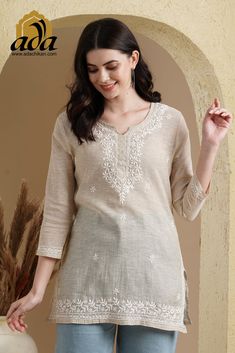 Find more items of ADA:- https://www.etsy.com/shop/ADAlucknow?ref=shop_sugg_market SKU: A911388 Color: Fawn Fabric: Khadi Cotton Length: 31 Inches Sleeves: Quarter Sleeves Neck: Notch Neck Slit Detail: N/A Embroidery:  "Murri, Phanda & Ghaspatti" Thread: Cotton Thread Color: White Touch and Feel: Soft and Comfortable Silhouette: A lively and cheerful top to light up your mood - perfect to wear to your office or at-home work setup. Detailed with Chikankari embroidery work on the yoke and hem with splashes of it on the back, this thigh-length top has three-quarter sleeves, notched neckline and a straight hem. Style it for your next weekend outing with colourful cotton drawstring waist pants and mules to complete the look. Disclaimer: This product is hand embroidered and may have slight dissi Khadi Kurti, Chikan Kurta, Short Kurti Designs, Khadi Kurta, Design Kurta, Rajasthani Dress, Churidar Neck Designs, Lucknowi Chikankari, Kurta For Women