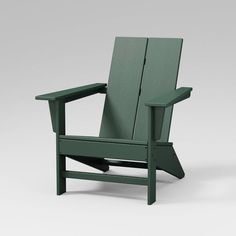 a green chair sitting on top of a white floor