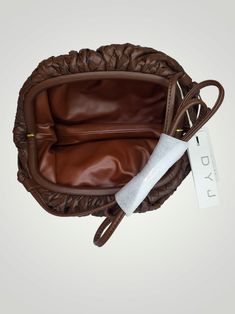 The DYJ Small Dumpling Bag brings style and function together. This luxurious bag features a coffee brown exterior, crafted from quality PU leather. The interior is fully lined and has plenty of space to store your everyday essentials. A modern strap make it easy to carry, making it perfect for everyday use. Coffee Brown Small Dumpling Bag Cross Body New With Tags Free Shipping in the US Boutique Adventures in an online retail store located in Aurora, MO. We specialize in Boutique, Bargain, and Wholesale Retail Sales. This item is liquidated merchandise from your favorite retail store. Dumpling Bag, Retail Sales, Coffee Brown, Retail Store, Everyday Essentials, Online Retail, Dumplings, A Coffee, Everyday Essentials Products