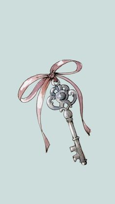 an old key with a pink ribbon tied around it