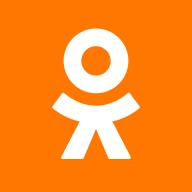 an orange square with a white symbol in the center and a person standing behind it