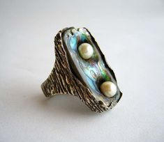 For Sale on 1stDibs - Modernist freshwater two pearl ring set in an abalone shell face created by jewelry artist Ursula Hammil. Rings face measures 1.5' by .75' and is a finger Rings Multiple, Pearl Rings Vintage, Abalone Ring, Abalone Jewelry, Modernist Ring, Vintage Cocktail Ring, Large Jewelry