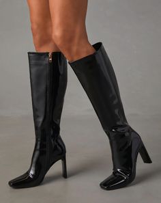 These high heeled boots sit right below the knee and offer a classy and elegant look, perfect for dressing up any outfit. 3.9" heel Closed pointed square toe Full zipper side closure Material: 100% Synthetic upper and lining, 100% Rubber outersole Tall Knee-high Boots For Fall Party, Sleek Knee-high Platform Boots For Party, Elegant Wide Calf Tall Mid-calf Boots, Chic High Shaft Platform Boots, Tall Evening Boots For Fall, Chic Fitted High Shaft Platform Boots, Knee-high Boots For Evening In Fall, Fitted Heeled Boots With Zipper And Pointed Toe, Tall Knee-high Boots For Evening In Fall