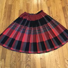 Moving Sale! Celebrate our move to OufVintage2 with 10%Off today. Check out our new shop at https:/oufvintage2.etsy.com. This is an awesome colorful mid length pleated plaid skirt! Made in a soft lightweight wool and woven fabric in the classic plaid design. The colors are still brilliant and blended in shades of red, gray, and black. It's a great find and so wearable! The waistband has a button closure and vintage metal zipper. No labels. Fantastic vintage condition with no issues Again, no lab Red Pleated Midi Skirt For Fall, Red Midi Pleated Skirt For Fall, Red Pleated Lined Skirt For Fall, Scottish Style Plaid Skirt For Fall, Scottish Plaid Skirt For Fall, Fall Scottish Plaid Skirt, Plaid Flared Pleated Lined Skirt, Plaid Flared Pleated Skirt With Lining, Fall Plaid Pleated Flared Skirt