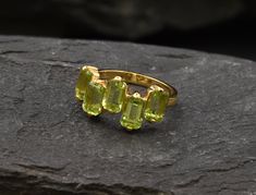 Gold Peridot Ring set with Natural Peridot in a perfect emerald cut, flawless clarity & beautiful green color, sourced from Brazil, at 6x4mm each, 3.5 Carats combined. Gold Baguette Ring made of Gold Vermeil ☞ thickest 18k Gold Plating on top of Solid 925 Sterling Silver ☞ made to last. Matching Earrings: www.etsy.com/uk/listing/1065539653 Matching Pendant - please ask me August Birthstone - Genuine & Natural Stones ❀ ☞ Choose your size ☞ I resize (before shipping) for FREE to Any size* ⌛Last Ri Peridot Ring Gold, Gold Baguette Ring, Gold Peridot Ring, Emerald Cut Ring, Ring Emerald Cut, Baguette Ring, Emerald Cut Rings, Real Jewelry, Ring Emerald