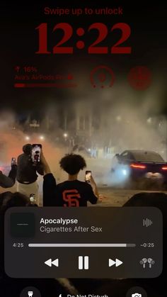 an app that is showing the time and location of two people in front of a car