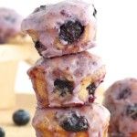 a stack of blueberry donuts sitting on top of each other next to berries