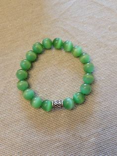 Simply slip on and enjoy this delicate green bracelet. Green Bracelet, Elastic Bracelet, St Patricks Day, Jewelry Bracelets, Handmade Items, Etsy Gift Card, Beaded Bracelets, Slip On, Elastic