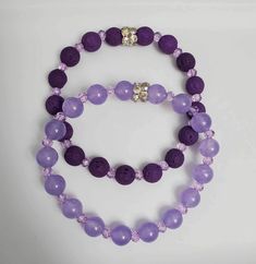 Set of Two Stretch Bracelets Includes a Deep Purple Lava Bead Bracelet & a Lavender Bracelet Made in USA Purple Beaded Stretch Bracelet, Elegant Purple Bracelets With 8mm Beads, Purple 8mm Beads Bracelet, Purple Hand-strung Stretch Bracelet, Adjustable Purple Hand-strung Stretch Bracelet, Lava Bead Bracelet, Purple Bracelet, Lava Bead, Dark Purple