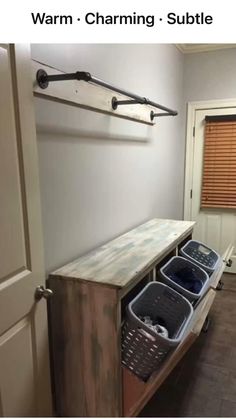 an entryway with storage baskets on the floor