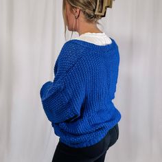 Get ready to cozy up with our Chunky Sweater Cardigan! This royal blue beauty is not only oversized and chunky knit, but it also features a convenient button up design. Perfect for bundling up and adding a pop of color to your outfit. (Go ahead, make a statement!) Also, perfect for gamedays if your team color is blue! Fabric: 100% acrylic I am wearing the size large - This cardigan is fitting oversized. If you are between sizes, you could size down. Stats: height: 5'7 - bust: 37 - waist: 34 - hi Wedding Guest Accessories, Faith Based Gifts, Chunky Sweater Cardigan, Maxi Jumpsuit, Blue Beauty, Sweater Tank Top, Lounge Shorts, Chunky Sweater, T Shirt Vest