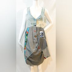 The Desigual Patchwork Dress Is A Women's Dress From The Brand Desigual. It Features A Patchwork Design Using Various Shades Of Blue Fabrics. The Torso Of The Dress Is Made From Light Wash Blue Denim, Giving It A Casual And Relaxed Look. It Has A Plunging V Neckline And Frayed Edges, Adding A Touch Of Edginess To The Dress. The Dress Is Sleeveless, Allowing For Freedom Of Movement. The A-Line Skirt Portion Of The Dress Is Made From Varying Shades Of Blue Fabrics, Including Dotted And Striped Fab Blue Fabrics, Skirt Diy, Diy Skirt, Graphic Dress, Sleeveless Dress Summer, Butterfly Dress, Patchwork Dress, Knee Dress, Midi Dress With Sleeves