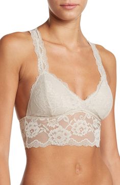 A sultry floral lace bralette with a back cutout offers a sophisticated style that can be worn as bold standout piece or a supportive underwear. V-neck Shell: 86% rayon, 14% spandex; lining: 95% polyester, 5% spandex Hand wash, dry flat Imported Elegant Fitted Bra With Lace Top, Spring Lace Bra With Lace Closure, Lace Bra With Lace Closure For Spring, Lace Bra For Spring, Seamless Lace Top, Elegant Lace Bra With Lace Top, Chic Lace Bra With Lace Trim, Elegant Spring Bra With Delicate Lace, Elegant Low-cut Bra For Spring