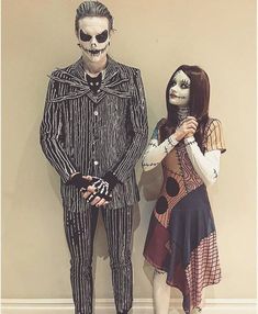 two people dressed up in costumes standing next to each other