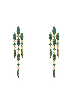 Looking for a truly eye-catching earring? Valencia Statement Drop Earring Emerald Green Cz Gold are the perfect choice!  This beautiful piece of statement jewellery will add a touch of colour and glamour to any outfit. The Valencia statement drop earring, handcrafted in 925 sterling silver dipped in gold, dazzles with an abundance of emerald green sparkling zircons beautifully set within eight marquis shaped settings and single square cut zircons, all linked together in a triple strand drop desi Luxury Elegant Green Danglers, Luxury Green Danglers For Formal Events, Luxury Green Elegant Danglers, Statement Earrings Wedding Green, Luxury Green Fusion Style Bridal Earrings, Luxury Green Danglers For Festive Occasions, Luxury Fusion Style Green Bridal Earrings, Square Emerald Drop Earrings, Luxury Green Earrings For Formal Occasions