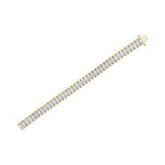 A must have for any serious jewelry collection, this stunning 14K yellow and white gold tennis bracelet boasts an impressive 5.0 carat total weight of diamonds with a whopping 217 individual stones. The bracelet features rectangular links with round, brilliant cut diamonds in four prong settings centered between baguette cut diamonds flush set into the wedged sides of the links, creating a reflective appearance. The interior of the links are 14K white gold, while the outside of the links are mad White Baguette Diamond Tennis Bracelet, White Tennis Bracelet With Baguette Diamonds, Classic White Tennis Bracelet With Baguette Diamonds, Classic White Baguette Cut Diamond Bracelet, White Diamond Bracelet With Baguette Diamonds For Anniversary, White Baguette Cut Diamond Bracelet, White Baguette Cut Diamond Bracelet Fine Jewelry, White Baguette Cut Diamond Tennis Bracelet, White Tennis Bracelet With Baguette Cut And Prong Setting