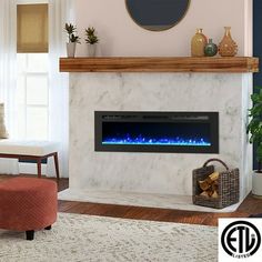 a living room with a white fireplace and blue flames on the mantle in front of it