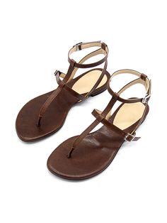 Editor's NotePretty yet comfy sandals will complete your summer look- Gladiator-like strappy sandals- Adjustable fit with the buckles on the straps- The ankle strap secures the feet- Flat design that goes with everything in the summerMeasurement (inch)- KR230(US 6)-KR255(US 8.5)- Height 0.4in.* Fits true to the size* Please refer to the size chartComposition & Care- Goat skin* Deformation or discoloring might happen if in contact with humid air or high temperature* Avoid rain and snow* Brown T-strap Footbed Sandals For Summer, Summer Toe Ring Sandals With Adjustable Ankle Strap, Summer T-strap Sandals With Adjustable Straps, Spring Toe Loop Sandals With Tang Buckle, Summer T-strap Toe Loop Sandals With Heel Strap, Summer Toe Loop T-strap Sandals, Summer T-strap Sandals With Adjustable Ankle Strap, Toe Loop Sandals With Tang Buckle For Summer, Brown Summer Footbed Sandals With Tang Buckle