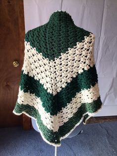 This is a very soft and warm handmade crocheted shawl . It's made with different shades of a dark green with a creamy white yarn in between. I can make this in any color or size also. Green Crochet Shawl For Winter, Green Hand Knitted Shawl For Winter, One Size Green Crochet Shawl, Handmade Green Shawl For Winter, Shades Of Dark Green, Crocheted Shawl, Green Crochet, Crochet Shawl, Creamy White