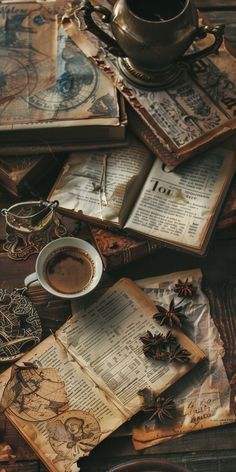 an old book, cup of coffee and other items are scattered on the table top