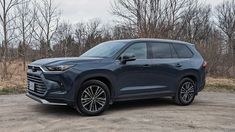 the front end of a blue 2020 chevrolet blaze parked in a parking lot near trees