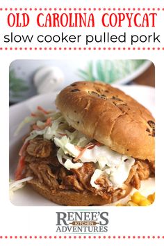 an image of a pulled pork sandwich with cole slaw on it and text overlay that reads old carolina copycat slow cooker pulled pork