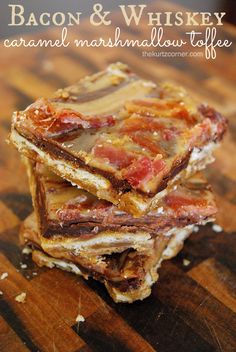 bacon and whiskey caramel marshmallow toffee bars stacked on top of each other