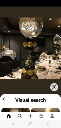 a table set for a party with balloons and confetti on the top of it