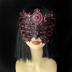 Seer Blindmask Beautiful ornate blindmask to unleash your gothic fantasy. This mask is in a brushed red effect with red rhinestones, finished with filigree flowers and two skeletal hands. Perfect for gothic brides, engagement photoshoots, evil queen cosplays, alt events, music videos and more. Other colour variations available, please DM in advance with your request.  Handmade to order. This design will take between 3-6 weeks during busy times. ------------------------------------------------ Sa Fantasy Couture, Red Effect, Couture Halloween, Vampire Mask, Gothic Bride, Red Gothic, Face Veil, Burlesque Costume, Gothic Accessories