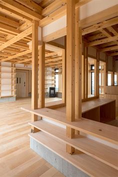 an empty room with wooden beams and benches