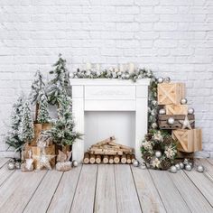 a white fireplace with christmas decorations and presents on the mantle, surrounded by wooden logs