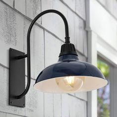 an outdoor wall light on the side of a building