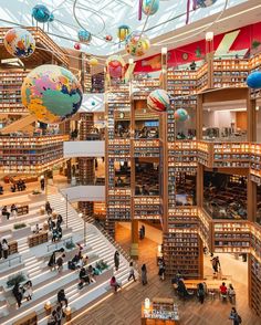 a library filled with lots of books and people