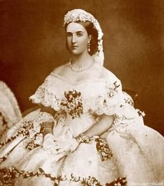 an old photo of a woman in white dress