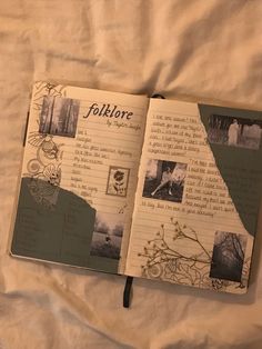 an open book with pictures on it sitting on top of a sheet of white paper