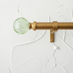 a close up of a light fixture on a white wall