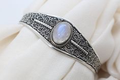 Moonstone Bracelet for Women - Handmade Filigree 925 Sterling Silver moonstone cuff bracelet - Moonstone Jewelry Cuff bracelets for women. Detailed Workmanship. *Material: 925 Sterling Silver Handmade *Design: Filigree and oxidized cuff bracelet *Item Weight: 20 to 25 gram *Stone : Natural Moonstone *Style: Cuff More moonstone cuff bracelets. https://nepalsilverjewelery.etsy.com/listing/1410648525 All our jewelry comes with a beautiful handmade pouch. Ready to ship in just 6-10 business days. Elegant Moonstone Jewelry For Festivals, Bohemian Gemstone Wedding Bangle, Bohemian Moonstone Bracelet, Bohemian Gemstone Bracelets For Wedding, Bohemian Wedding Bracelets With Gemstones, Bohemian Wedding Gemstone Bracelets, Silver Bohemian Moonstone Bracelets, Bohemian Silver Moonstone Bracelets, Bohemian Moonstone Gemstone Bracelets