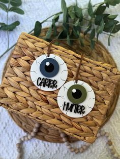 two fake eyes with the word'carer'painted on them in front of a basket