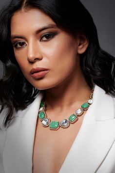 The Mint Polki Necklace is a blend of Indo-western style and modern glamour, featuring mint glass crystals and polki stone beads meticulously crafted into a stunning piece of jewelry. Its intricate design will make you stand out elegantly on any occasion. Finish: Rhodium Plating Material: Silver, Copper Alloy, Polki, Crystals Color: Mint Size: Free Size, Adjustable Closure Type: Lobster Box Contains: 1 Necklace Hand Jewelry Rings, Chain Braid, Polki Necklace, Indo Western, Hand Jewelry, Anklet Jewelry, Charm Gift, Intricate Design, Western Style