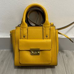 Nwot 3.1 Philip Lim X Target Yellow Vegan Leather Top-Handle Convertible Crossbody Satchel - Nwot; Smoke-Free Home - No Signs Of Damage Or Wear - Vegan Leather; Sustainable Fashion! - Detachable Strap Included; Can Even Be Converted Into A Backpack ! - Classic Style And Color Provides Universality As Well As Durability. Great Versatile Color For All Seasons. Support Sustainable Fashion: Reduce, Rewear, Recycle, Repair, Repurposeresell! *No Trades Please* *Open To Reasonable Offers; Additional Ph Yellow Square Satchel For Daily Use, Yellow Square Satchel With Handles, Yellow Satchel With Detachable Handle For On-the-go, Yellow Rectangular Bag With Adjustable Handle, Mustard Top, Yellow Crossbody Satchel With Gold-tone Hardware, Philip Lim, 3.1 Phillip Lim, Phillip Lim